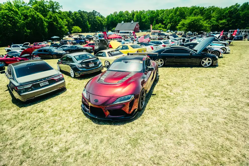 Rows of cars on the grass at the HyperFest car show